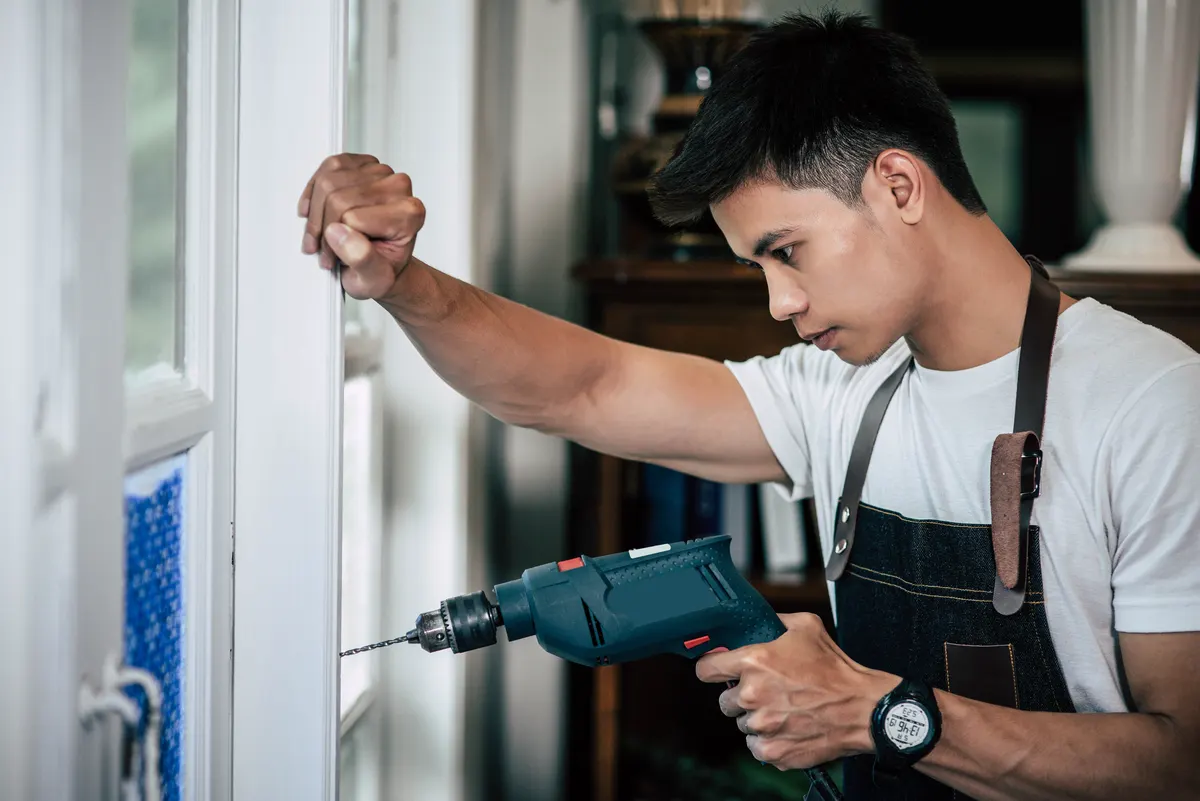 A skilled man working on door replacement