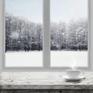 Winter home exterior with replacement window planning