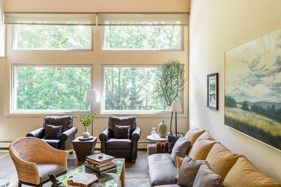 The same living room after with bright new full-height windows